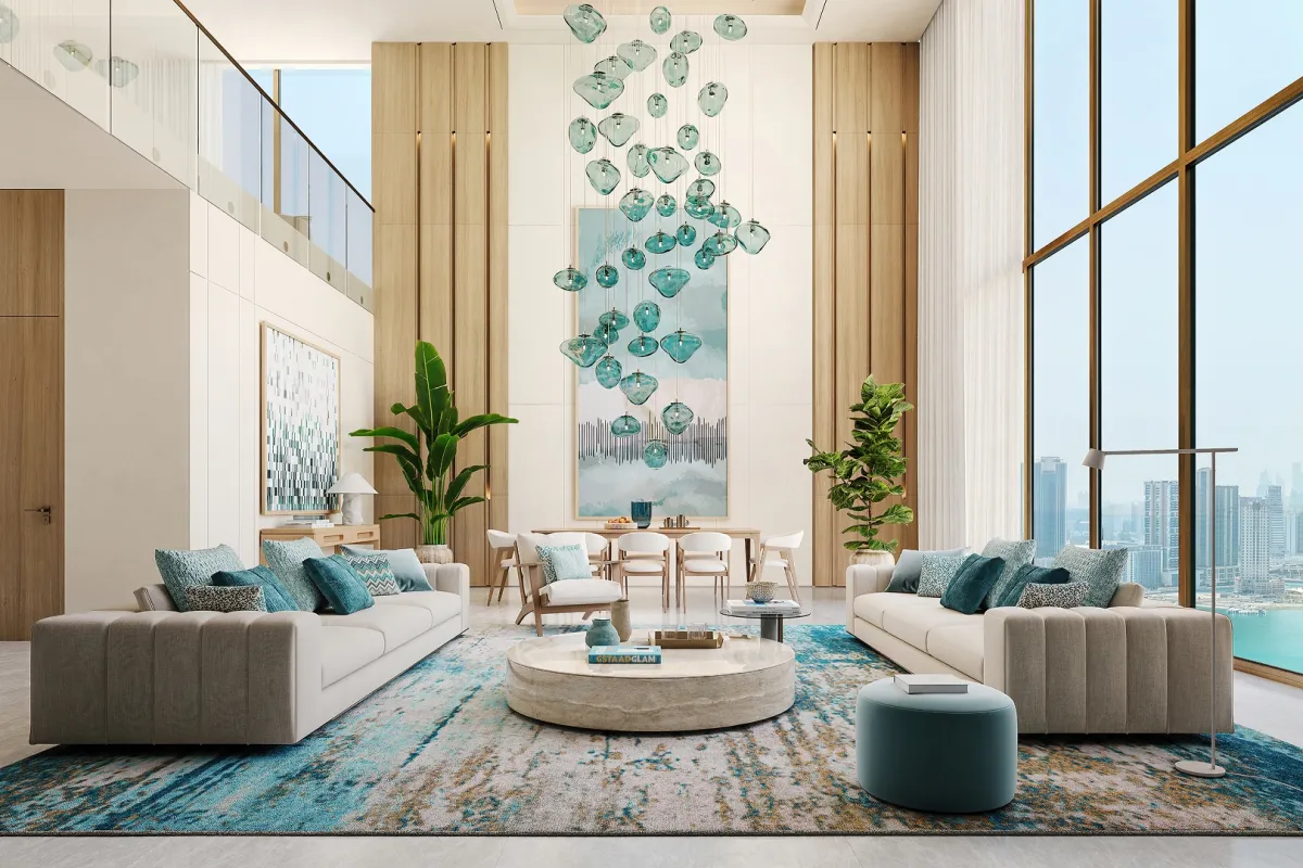 Double-height duplex living room with a glass-pendant chandelier at Bab Al Qasr Residence 77