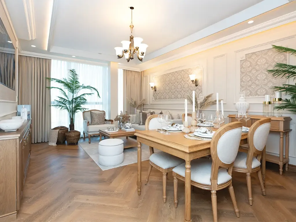 Dining room with chandelier and parquet flooring in a Bab Al Qasr residence