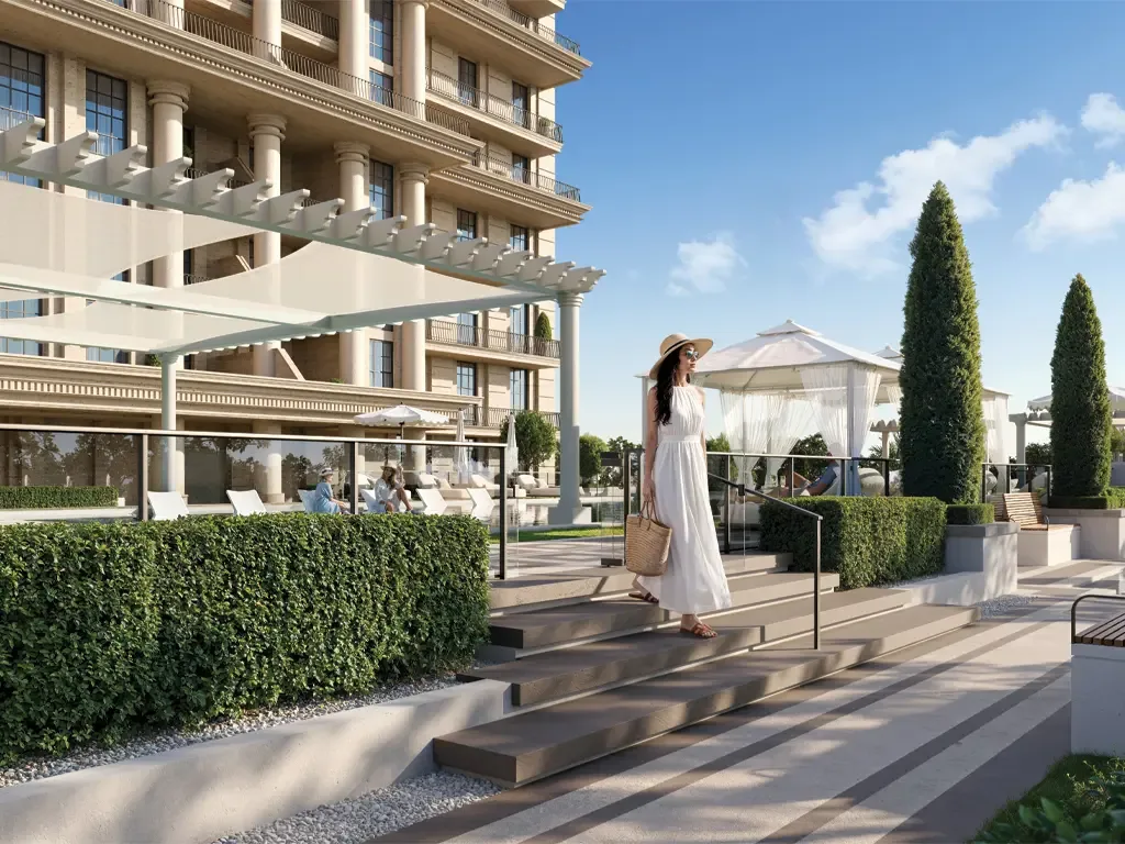 Landscaped podium steps and shaded arrival terrace at a Bab Al Qasr residence