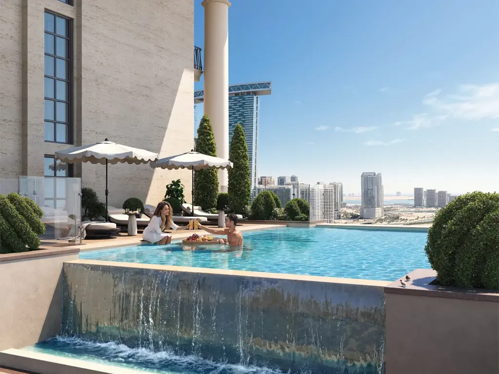 Rooftop infinity pool with parasols and loungers overlooking the Abu Dhabi skyline